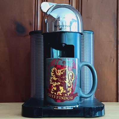 LOT 21: Nespresso VertuoLine Type GCA1 Coffee and Espresso Maker with Harry Potter Gryffindor Mug and Espresso Cups