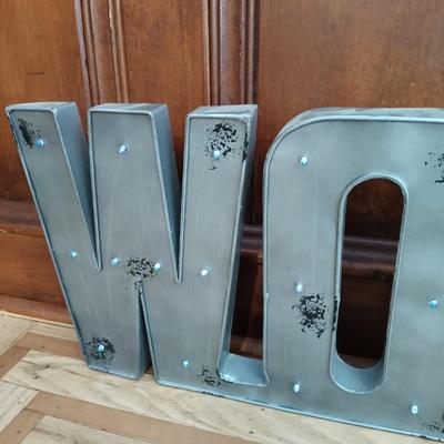 LOT 22: Inspirational Pastel Spring Decor Including LED Cinematic Light Box. Plaques, a Metal “WORK” Sign and More