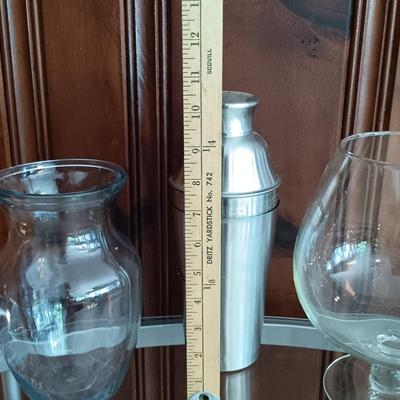 LOT 25: Metal and Glass Serving Cart with Glasses, Shaker, Tablecloths, Corkcicle Wine Pourer, Whimsical Straws and More