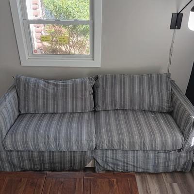 LOT 26: Comfy Crate & Barrel Love Seat/Sofa/Ottoman Set with Crate & Barrel Washable Slip Covers along with Spare Covers for the...