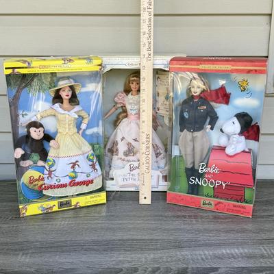 LOT 44P: NRFB Mattel Barbie Collector Edition Dolls: Tale of Peter Rabbit (19360), Barbie & Snoopy (55558) & Curious George (28789)