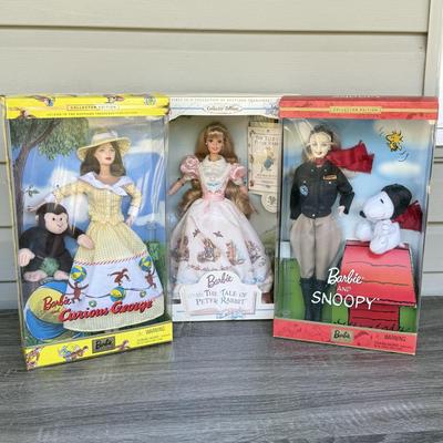 LOT 44P: NRFB Mattel Barbie Collector Edition Dolls: Tale of Peter Rabbit (19360), Barbie & Snoopy (55558) & Curious George (28789)