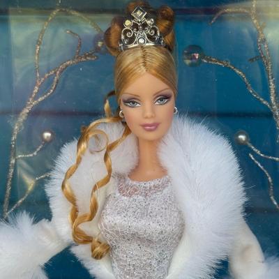 LOT 53P: NRFB Mattel Holiday Barbie Dolls: Barbie Signature 35th Anniversary 2023 Holiday Barbie (HJX04) & Two 2003 Special Edition...