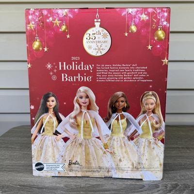 LOT 53P: NRFB Mattel Holiday Barbie Dolls: Barbie Signature 35th Anniversary 2023 Holiday Barbie (HJX04) & Two 2003 Special Edition...