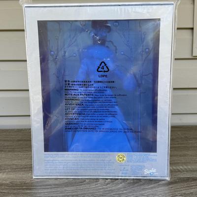 LOT 53P: NRFB Mattel Holiday Barbie Dolls: Barbie Signature 35th Anniversary 2023 Holiday Barbie (HJX04) & Two 2003 Special Edition...