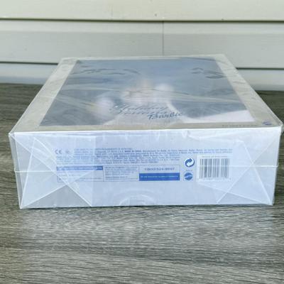 LOT 53P: NRFB Mattel Holiday Barbie Dolls: Barbie Signature 35th Anniversary 2023 Holiday Barbie (HJX04) & Two 2003 Special Edition...