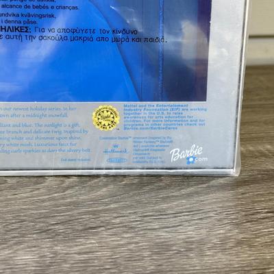 LOT 53P: NRFB Mattel Holiday Barbie Dolls: Barbie Signature 35th Anniversary 2023 Holiday Barbie (HJX04) & Two 2003 Special Edition...