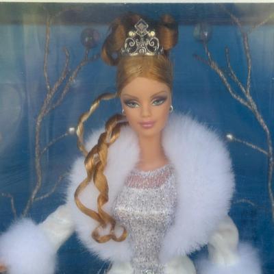 LOT 53P: NRFB Mattel Holiday Barbie Dolls: Barbie Signature 35th Anniversary 2023 Holiday Barbie (HJX04) & Two 2003 Special Edition...