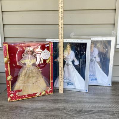 LOT 53P: NRFB Mattel Holiday Barbie Dolls: Barbie Signature 35th Anniversary 2023 Holiday Barbie (HJX04) & Two 2003 Special Edition...