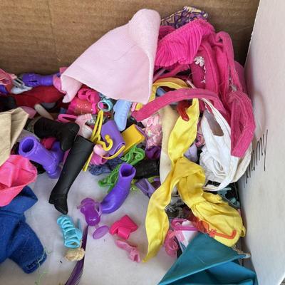 LOT 140P: Box of Barbie Sized Clothing & Accessories