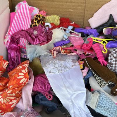 LOT 140P: Box of Barbie Sized Clothing & Accessories