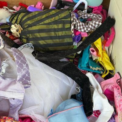 LOT 140P: Box of Barbie Sized Clothing & Accessories