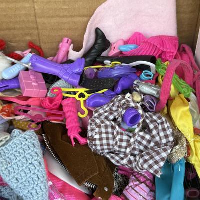 LOT 140P: Box of Barbie Sized Clothing & Accessories