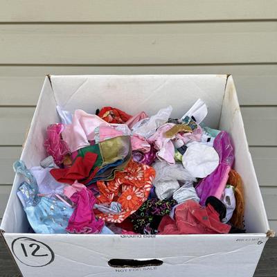 LOT 140P: Box of Barbie Sized Clothing & Accessories