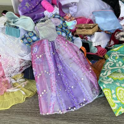 LOT 140P: Box of Barbie Sized Clothing & Accessories