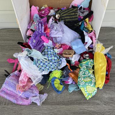 LOT 140P: Box of Barbie Sized Clothing & Accessories