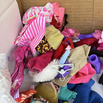LOT 140P: Box of Barbie Sized Clothing & Accessories