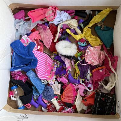 LOT 140P: Box of Barbie Sized Clothing & Accessories