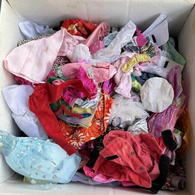 LOT 140P: Box of Barbie Sized Clothing & Accessories