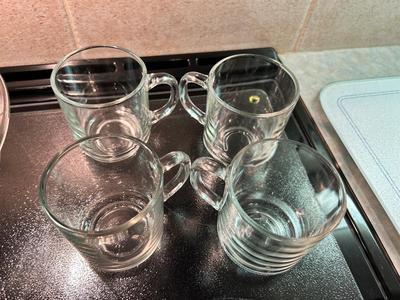 CLEAR GLASS KITCHEN MEASURING CUP, JUICER, JUICE GLASSES, MIXING BOWL, AND CUTTING BOARD
