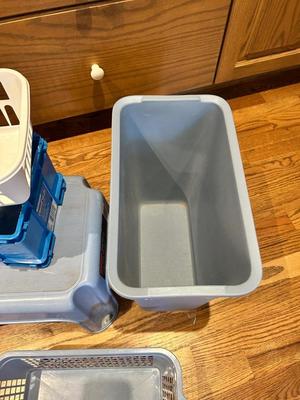 ORGANIZING STORAGE SOLUTIONS. A WASTE CAN AND STEP STOOL
