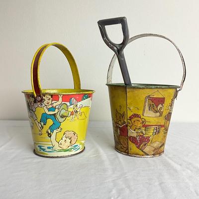 D905 Two Antique Tin Lithographed Sand Pails with Shovel
