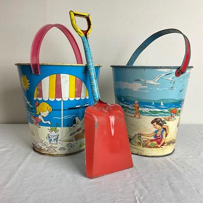 D908 Two J. Chein & Co. Beach Scene Sand Pails with Matching J. Chein Shovel