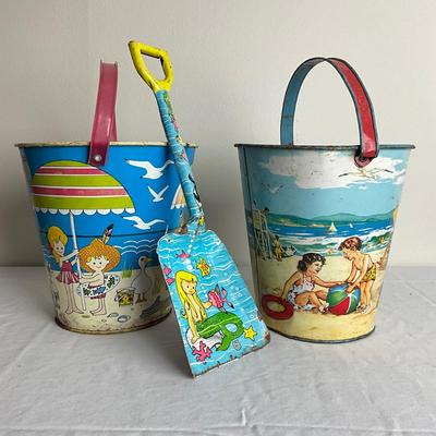 D908 Two J. Chein & Co. Beach Scene Sand Pails with Matching J. Chein Shovel