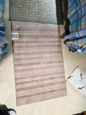 NEW AND LIKE NEW RUGS