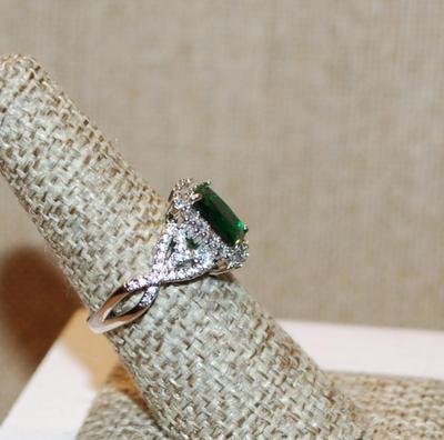 Size 7 Emerald Cut Green Stone Ring with Full Surround & Side Accents on a Silver Tone Band (4.3g)