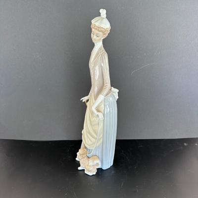 Lladro figurine 4761 "Woman with Umbrella and Dog."
