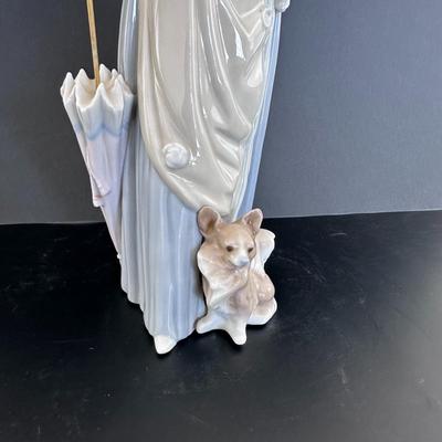 Lladro figurine 4761 "Woman with Umbrella and Dog."