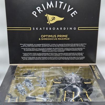LOT 17: Transformers primitive Skateboarding Optimus Prime & Shreddicus Maximus NIB
