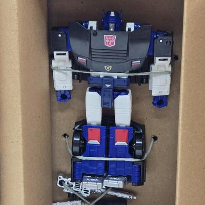 LOT 18: Two Transformers Deluxe Class Deep Cover WFC- GS23 NIB