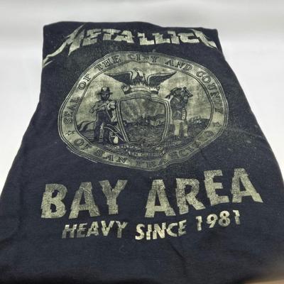 LOT 24: Two Metallica Shirts, Iron Maiden Bag, Two Metallica Blu-rays and one DVD