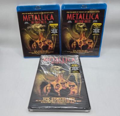LOT 24: Two Metallica Shirts, Iron Maiden Bag, Two Metallica Blu-rays and one DVD