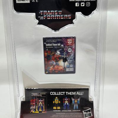 LOT 28: World's Smallest Action Micro Figures/ 3 Optimus Prime and 2 Bumblebees NIP