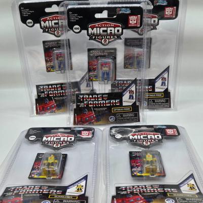 LOT 28: World's Smallest Action Micro Figures/ 3 Optimus Prime and 2 Bumblebees NIP