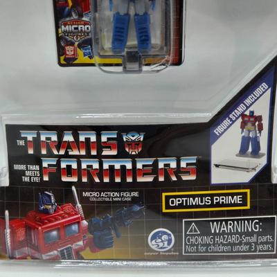 LOT 28: World's Smallest Action Micro Figures/ 3 Optimus Prime and 2 Bumblebees NIP