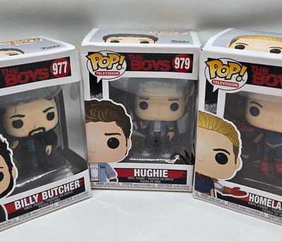 LOT 40: Variety of Funko Pops Including Predator, Batman, and Muhammad Ali NIB