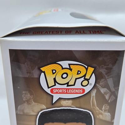 LOT 40: Variety of Funko Pops Including Predator, Batman, and Muhammad Ali NIB