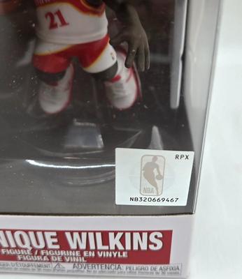 LOT 40: Variety of Funko Pops Including Predator, Batman, and Muhammad Ali NIB