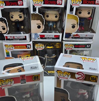 LOT 40: Variety of Funko Pops Including Predator, Batman, and Muhammad Ali NIB
