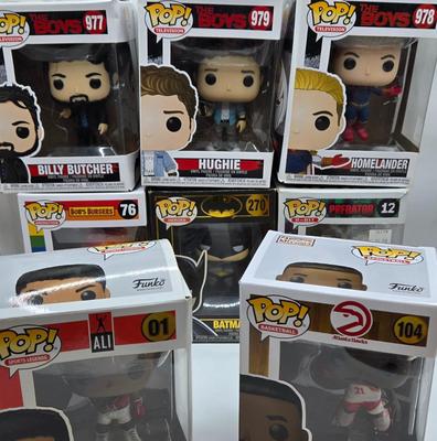 LOT 40: Variety of Funko Pops Including Predator, Batman, and Muhammad Ali NIB