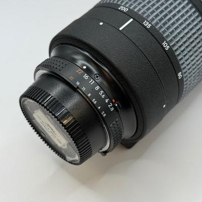 LOT 43: Nikon ED AF Nikkor 80-200mm 1:2.8 D f/2.8 Telephoto Lens w/ Quantaray 77mm UV Filter & Nikon HB-7 Lens Hood
