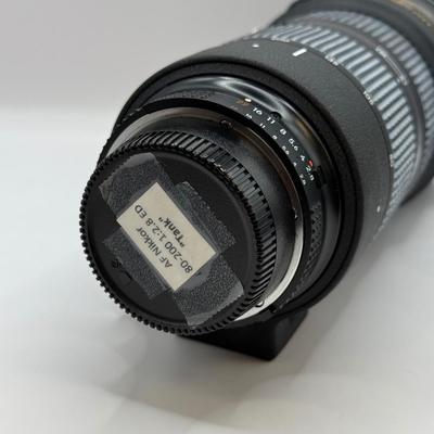 LOT 43: Nikon ED AF Nikkor 80-200mm 1:2.8 D f/2.8 Telephoto Lens w/ Quantaray 77mm UV Filter & Nikon HB-7 Lens Hood