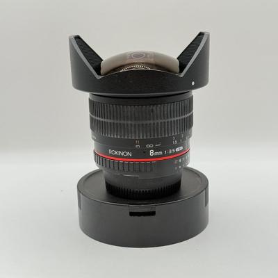 LOT 56: Rokinon 8mm 1:3.5 f/3.5 Fisheye CSII Lens w/ Hood (for Nikon Cameras)