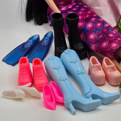 LOT 70: "Girls Just Wanna have Fun" Assortment of Barbies and Their Shoes...