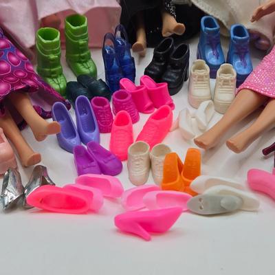 LOT 70: "Girls Just Wanna have Fun" Assortment of Barbies and Their Shoes...