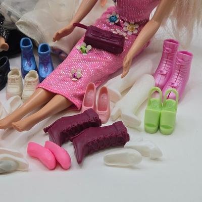LOT 70: "Girls Just Wanna have Fun" Assortment of Barbies and Their Shoes...